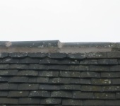 Ridge tiles requiring re-seating and re-pointing due to very poor prior workmanship